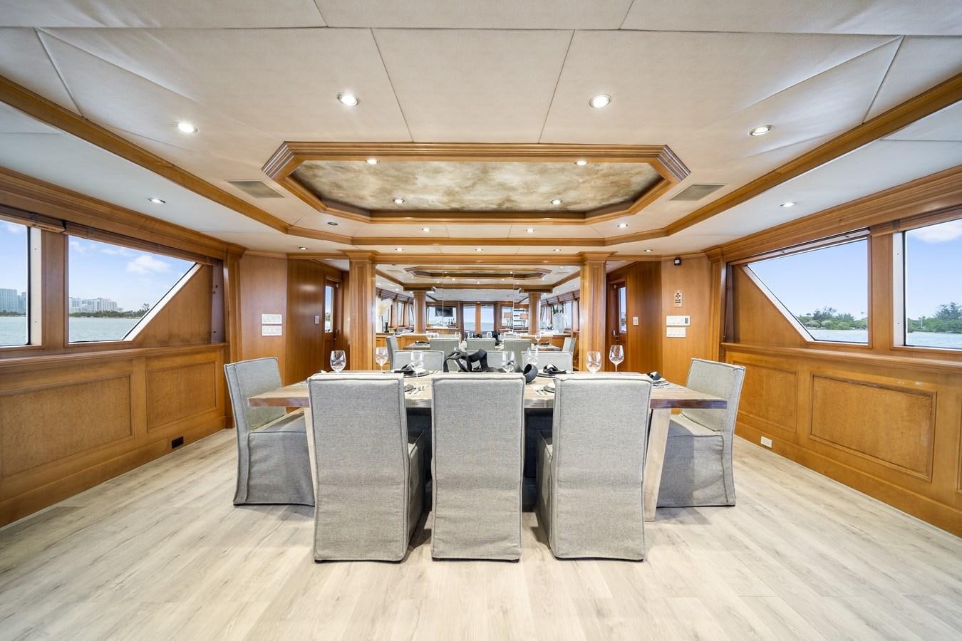 a large kitchen with a table and chairs aboard OCEAN DRIVE Yacht for Sale