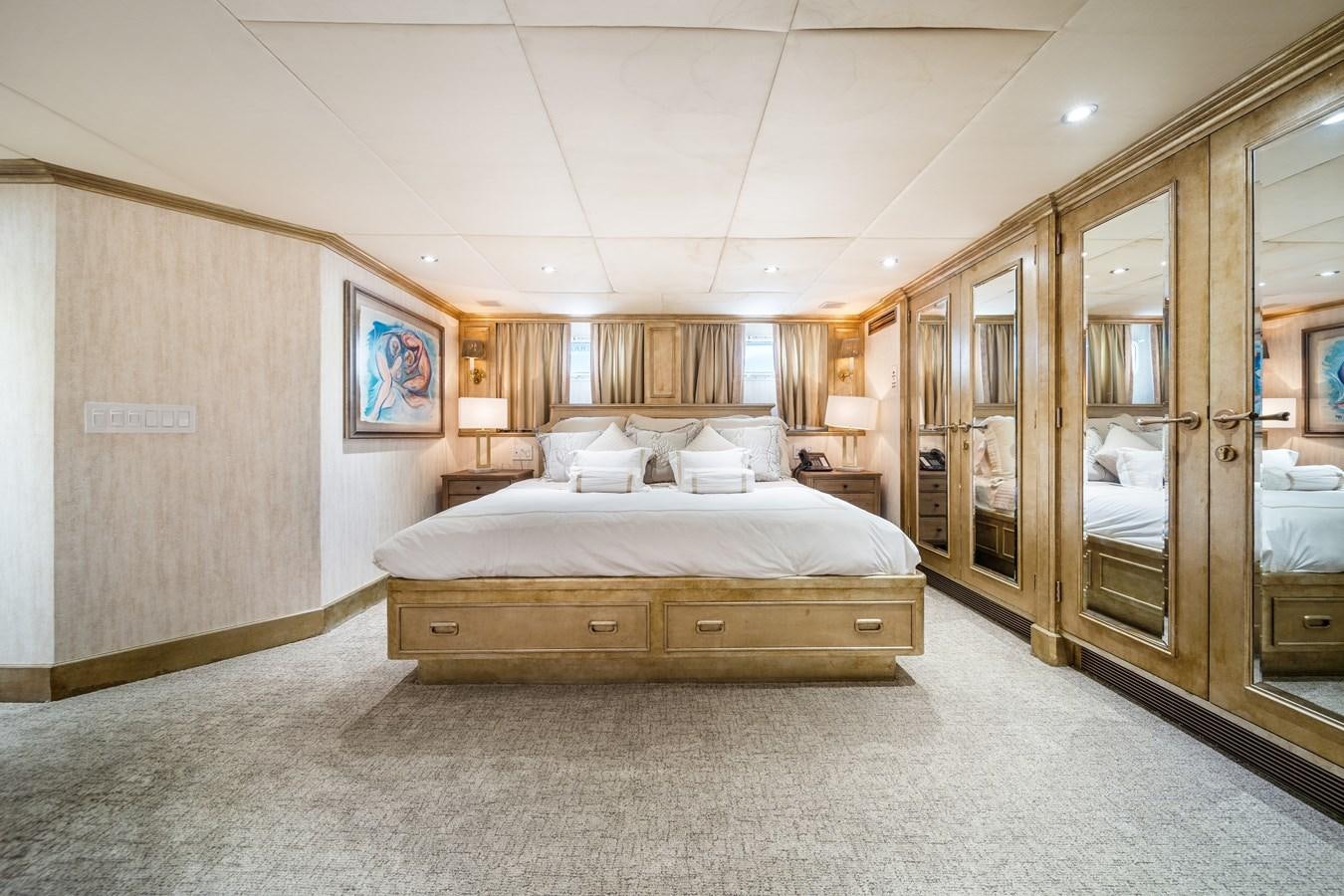 a bedroom with a bed and a closet aboard OCEAN DRIVE Yacht for Sale