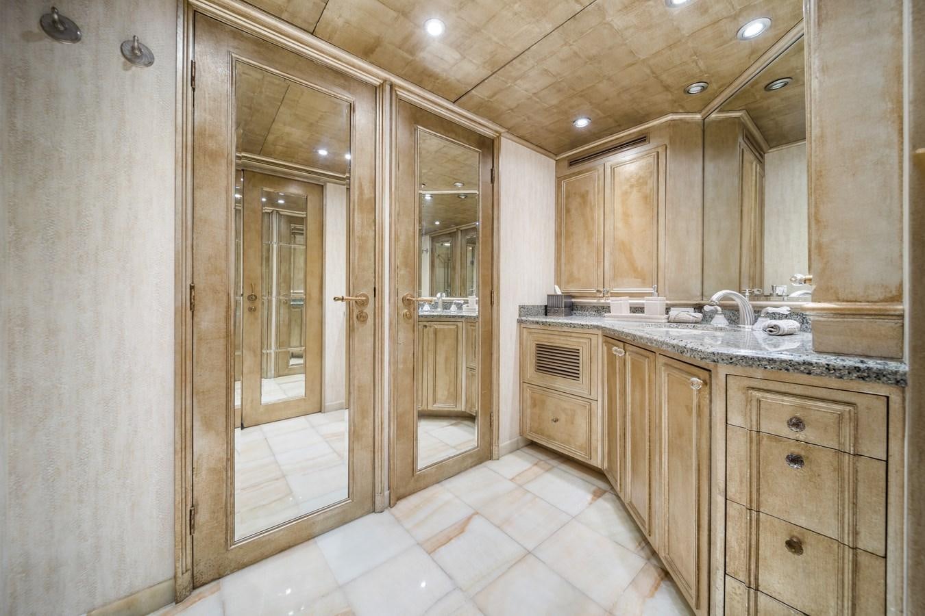 a bathroom with wooden cabinets aboard OCEAN DRIVE Yacht for Sale
