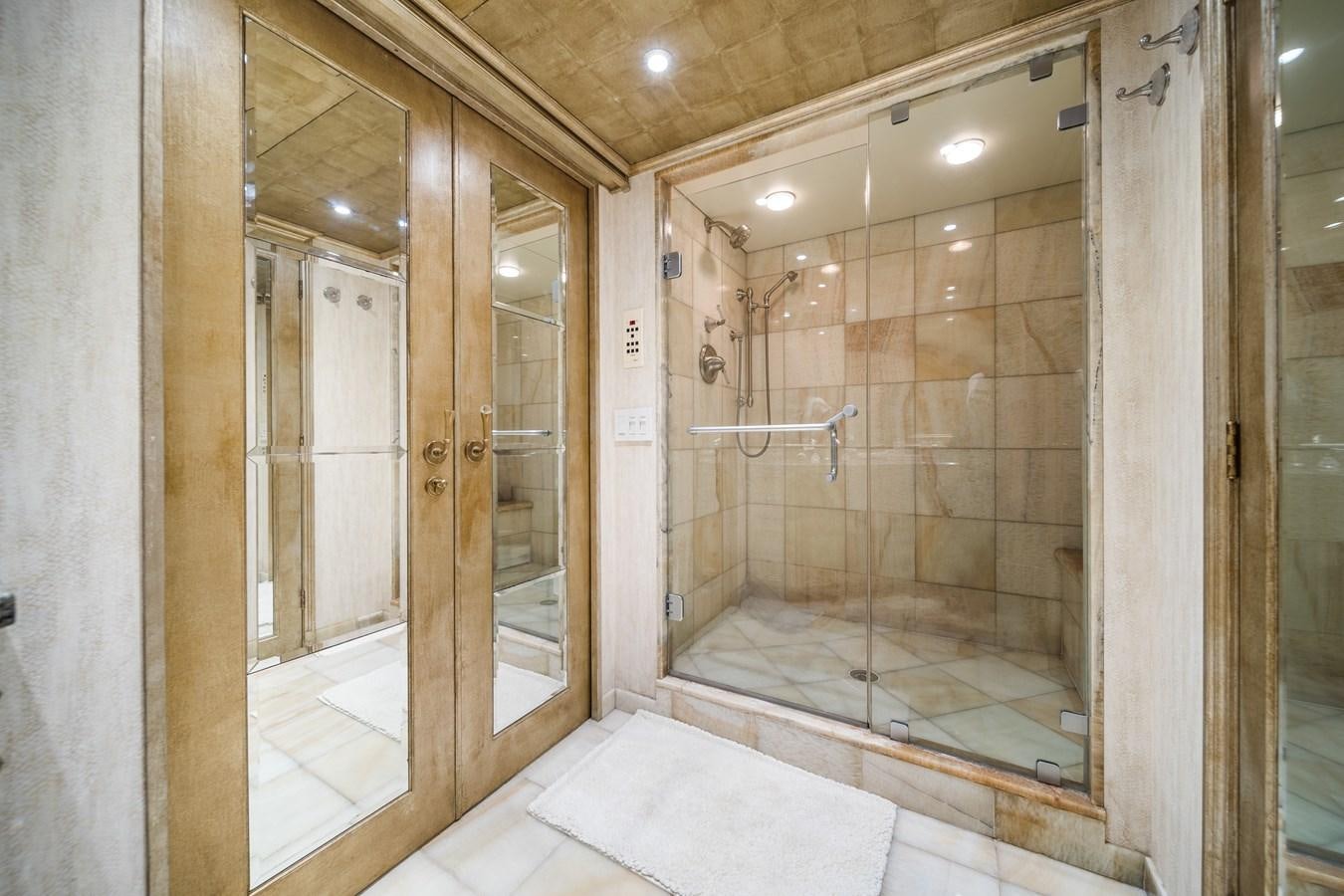 a bathroom with a glass shower aboard OCEAN DRIVE Yacht for Sale