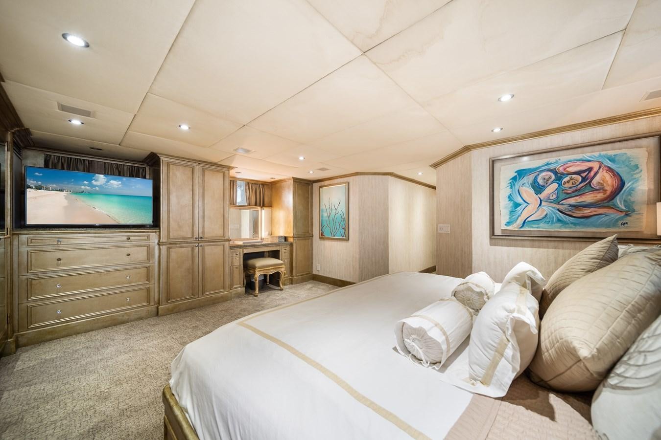 a bedroom with a large television aboard OCEAN DRIVE Yacht for Sale