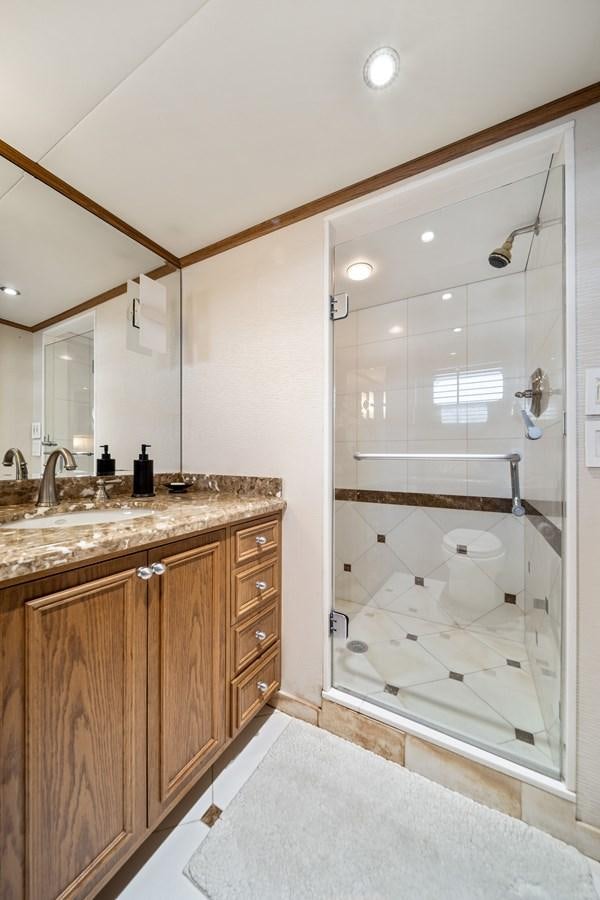 a bathroom with a glass shower aboard OCEAN DRIVE Yacht for Sale
