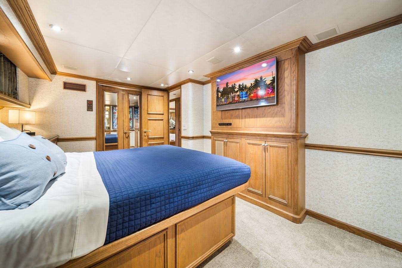 a bedroom with a bed and a television aboard OCEAN DRIVE Yacht for Sale