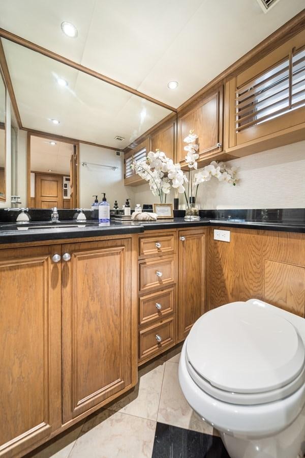 a bathroom with a toilet and a sink aboard OCEAN DRIVE Yacht for Sale