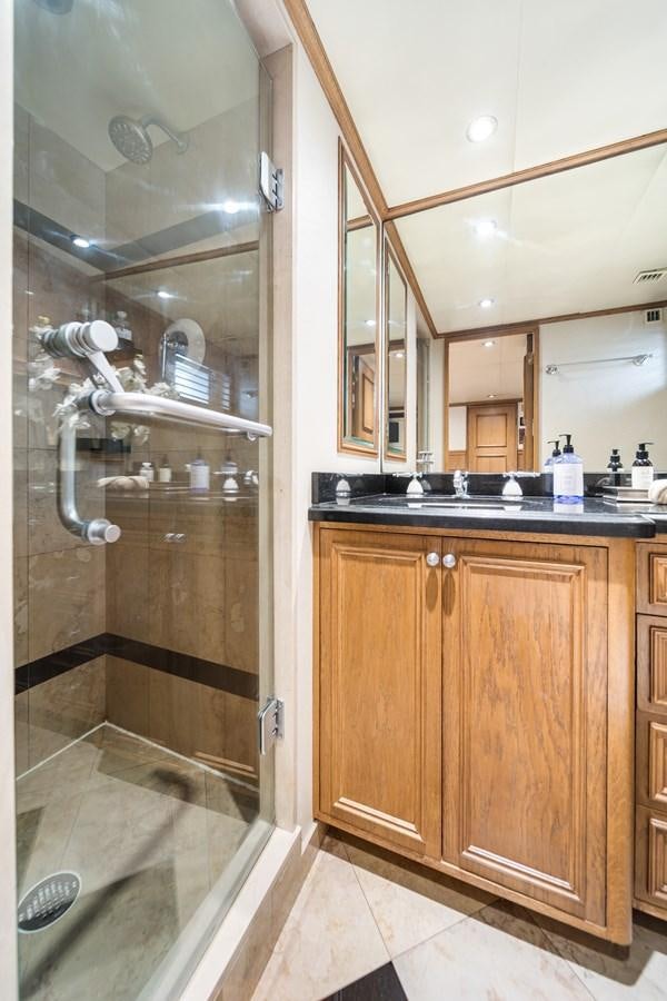 a bathroom with a glass shower aboard OCEAN DRIVE Yacht for Sale