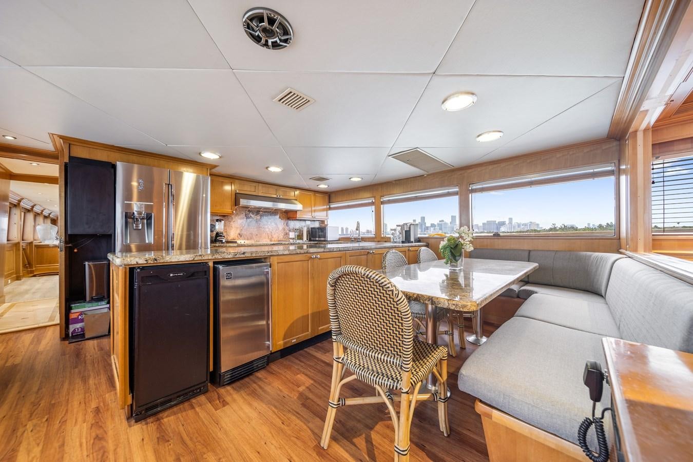 a kitchen with a table and chairs aboard OCEAN DRIVE Yacht for Sale