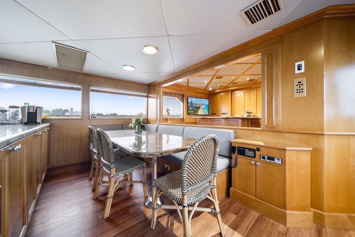 a kitchen with a table and chairs aboard OCEAN DRIVE Yacht for Sale