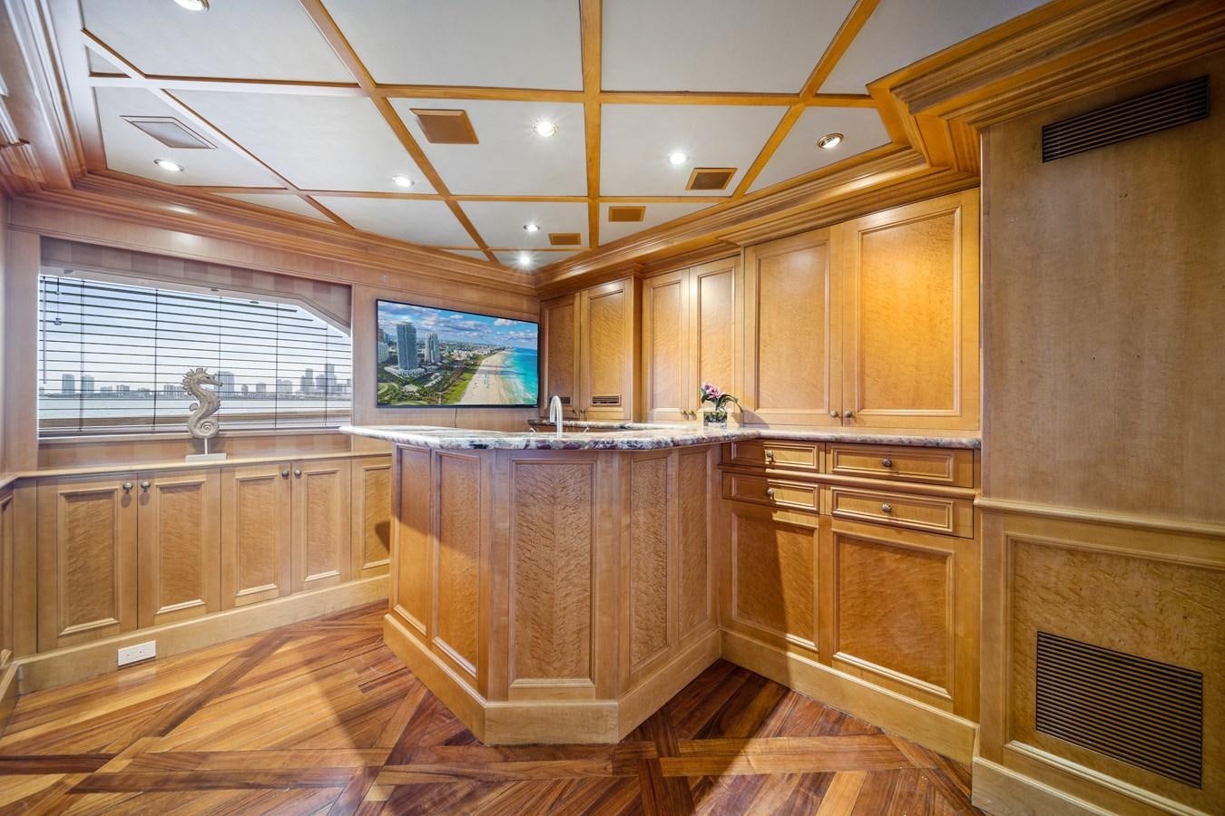 a kitchen with wooden cabinets aboard OCEAN DRIVE Yacht for Sale