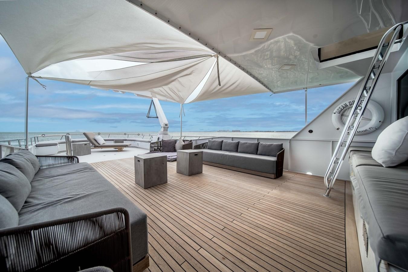 a tent with a bench and a bench aboard OCEAN DRIVE Yacht for Sale