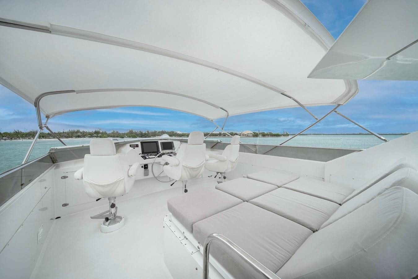 a white boat with a white canopy aboard OCEAN DRIVE Yacht for Sale
