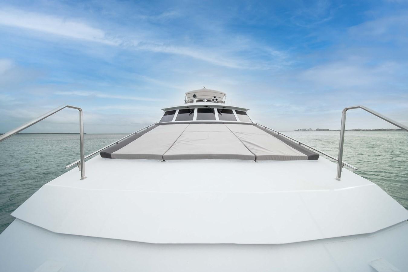 a white boat on a body of water aboard OCEAN DRIVE Yacht for Sale