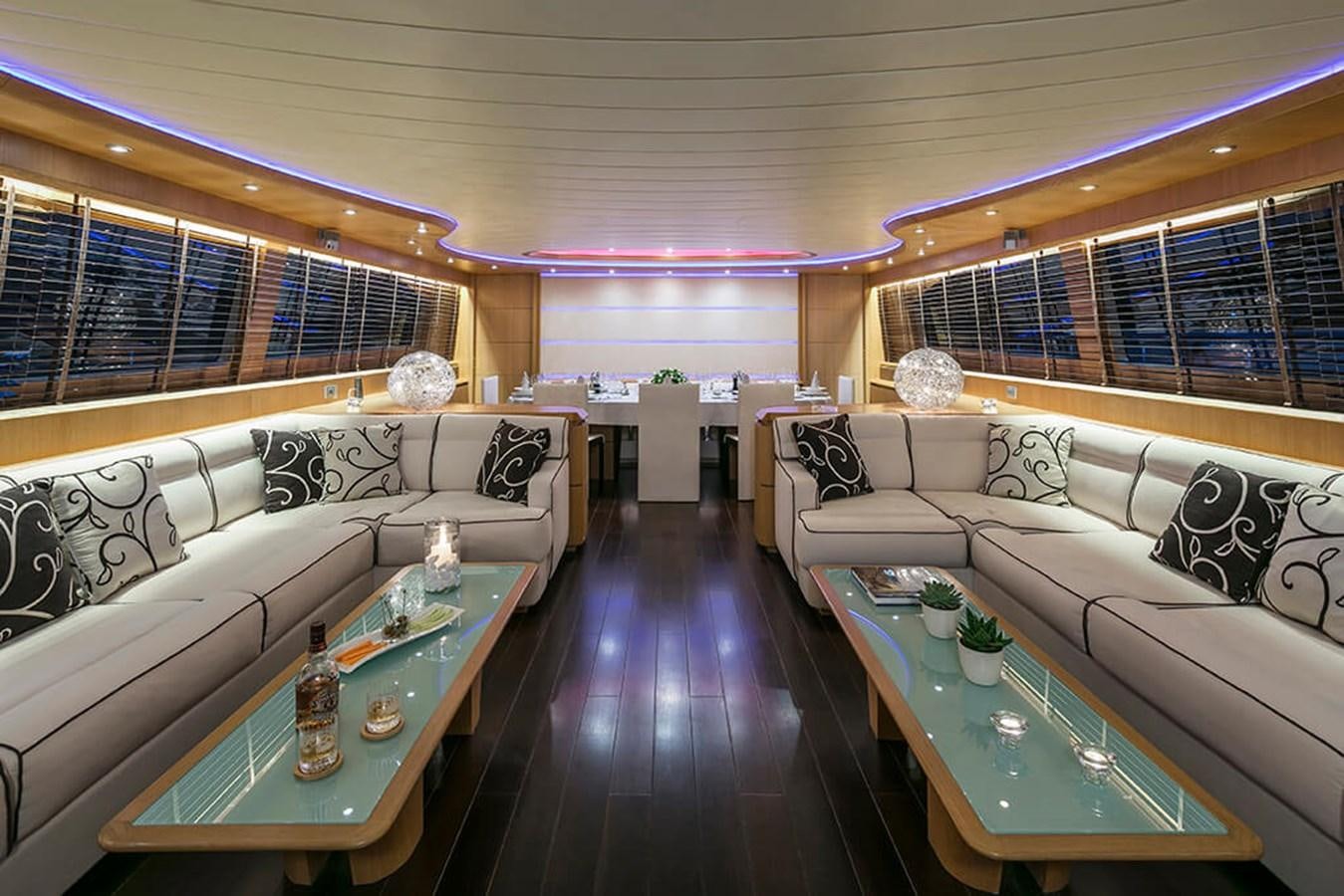 a living room with a couch and a coffee table aboard MAIORA 35 DP Yacht for Sale