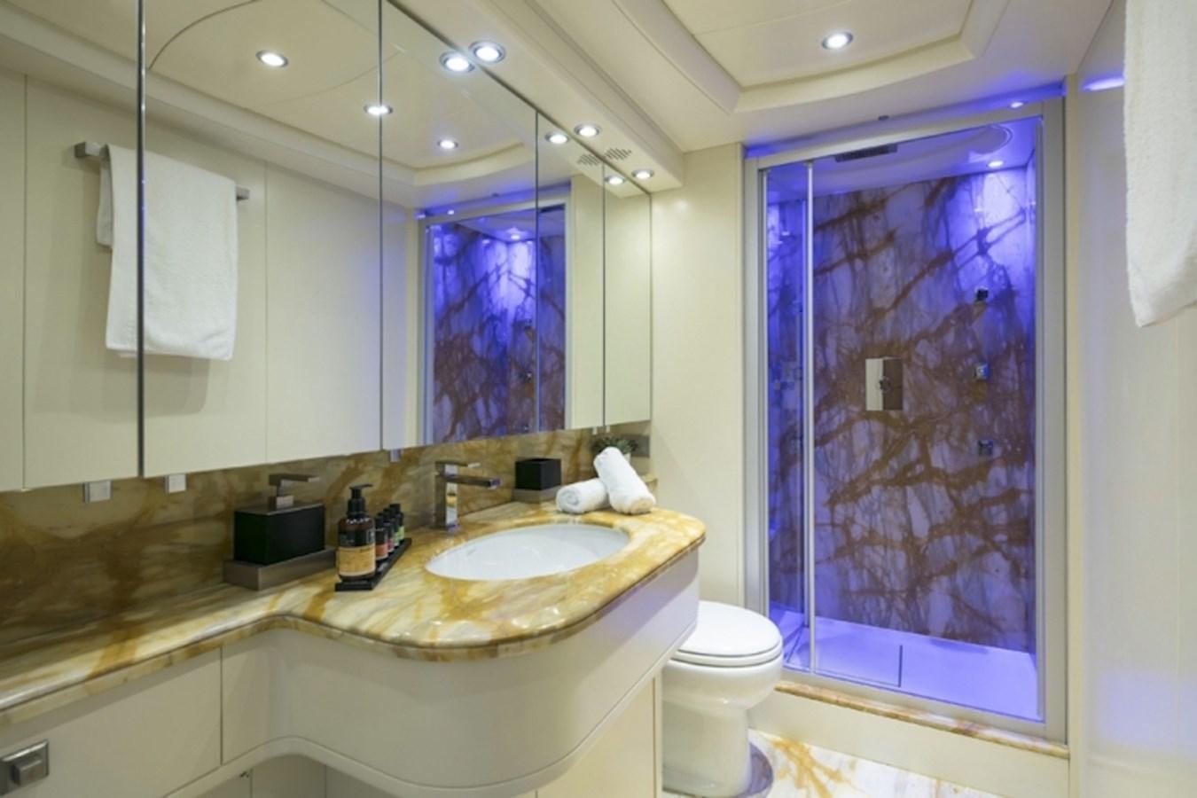 a bathroom with a large mirror aboard MAIORA 35 DP Yacht for Sale