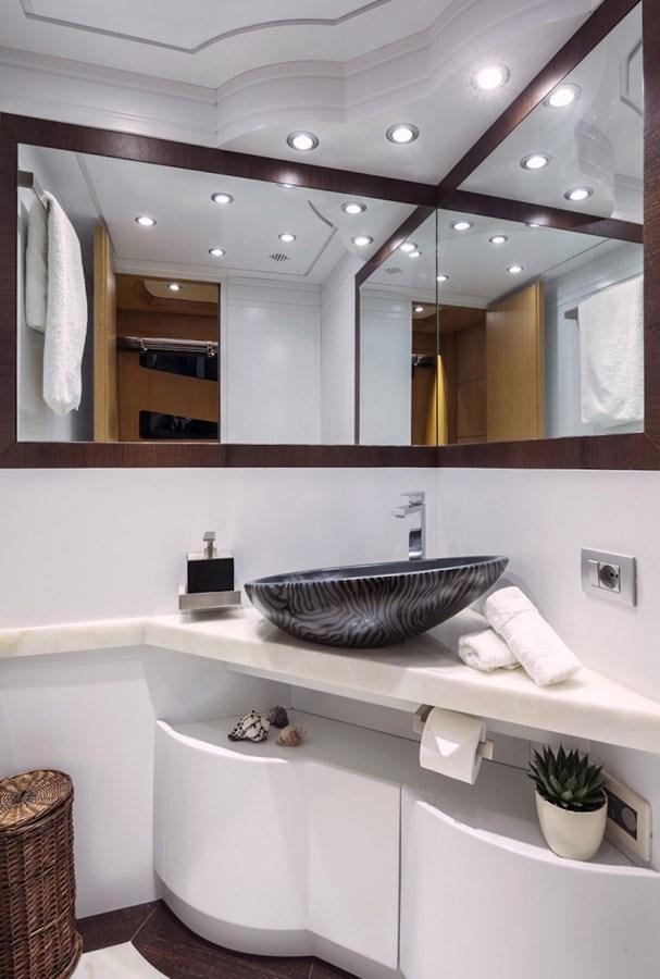 a bathroom with a sink and a mirror aboard MAIORA 35 DP Yacht for Sale