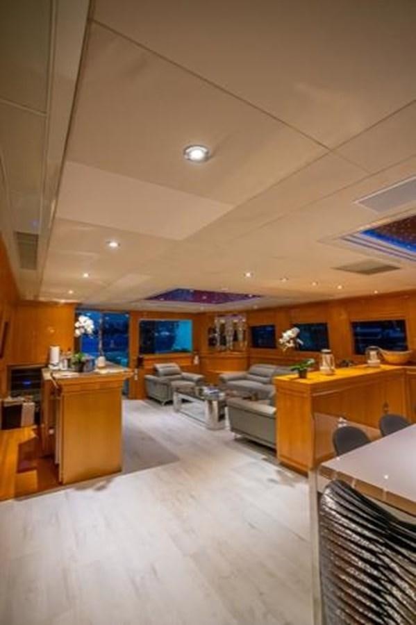 a large kitchen with a large window aboard 2000 116 BAGLIETTO Yacht for Sale