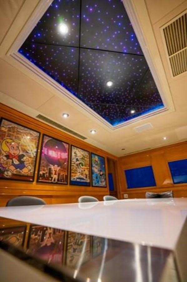 a room with paintings on the wall aboard 2000 116 BAGLIETTO Yacht for Sale