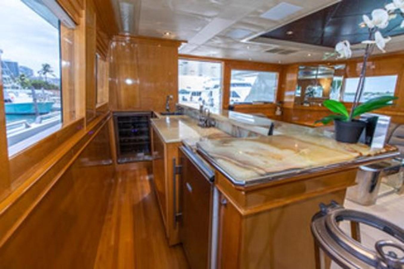 a kitchen with a large island aboard 2000 116 BAGLIETTO Yacht for Sale