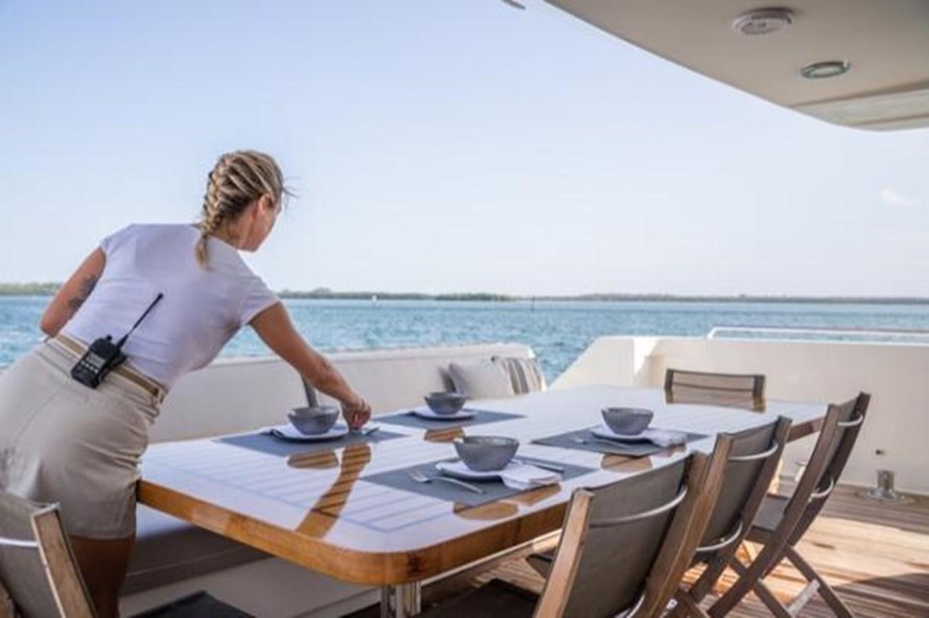 a person standing at a table aboard 2000 116 BAGLIETTO Yacht for Sale