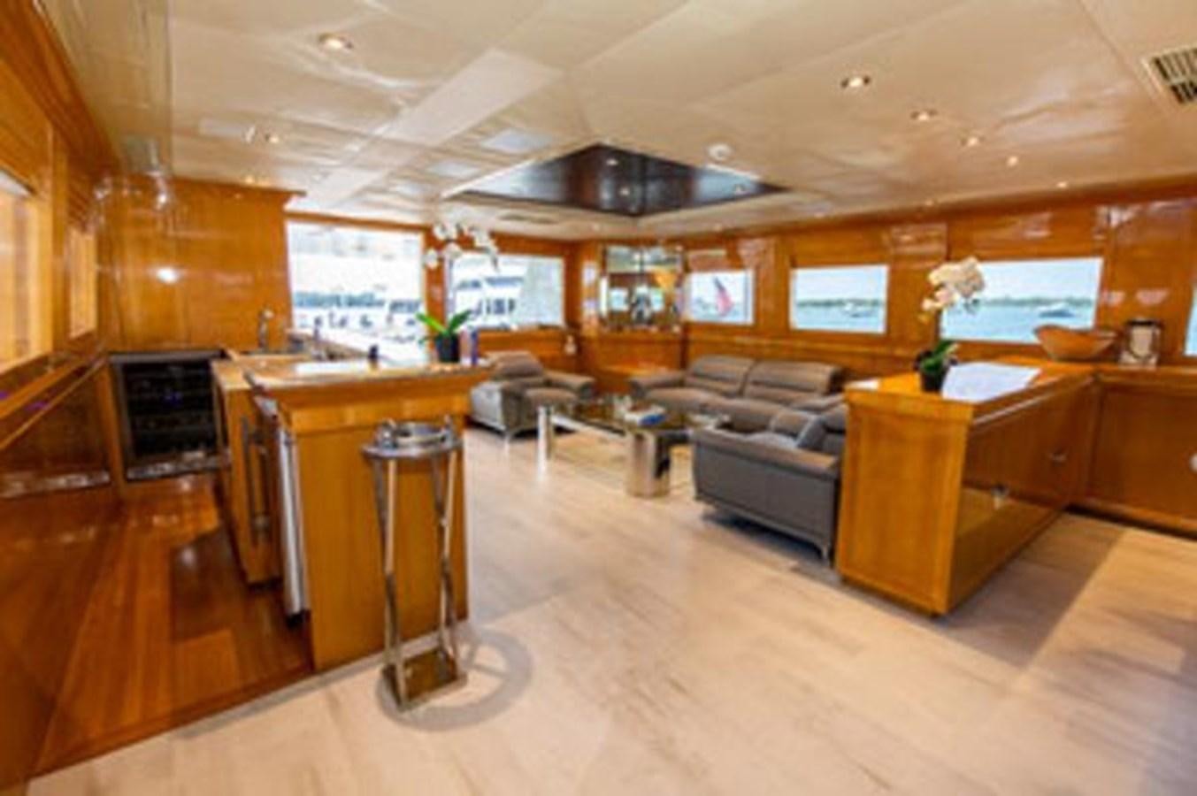 a large kitchen with a bar and bar area aboard 2000 116 BAGLIETTO Yacht for Sale