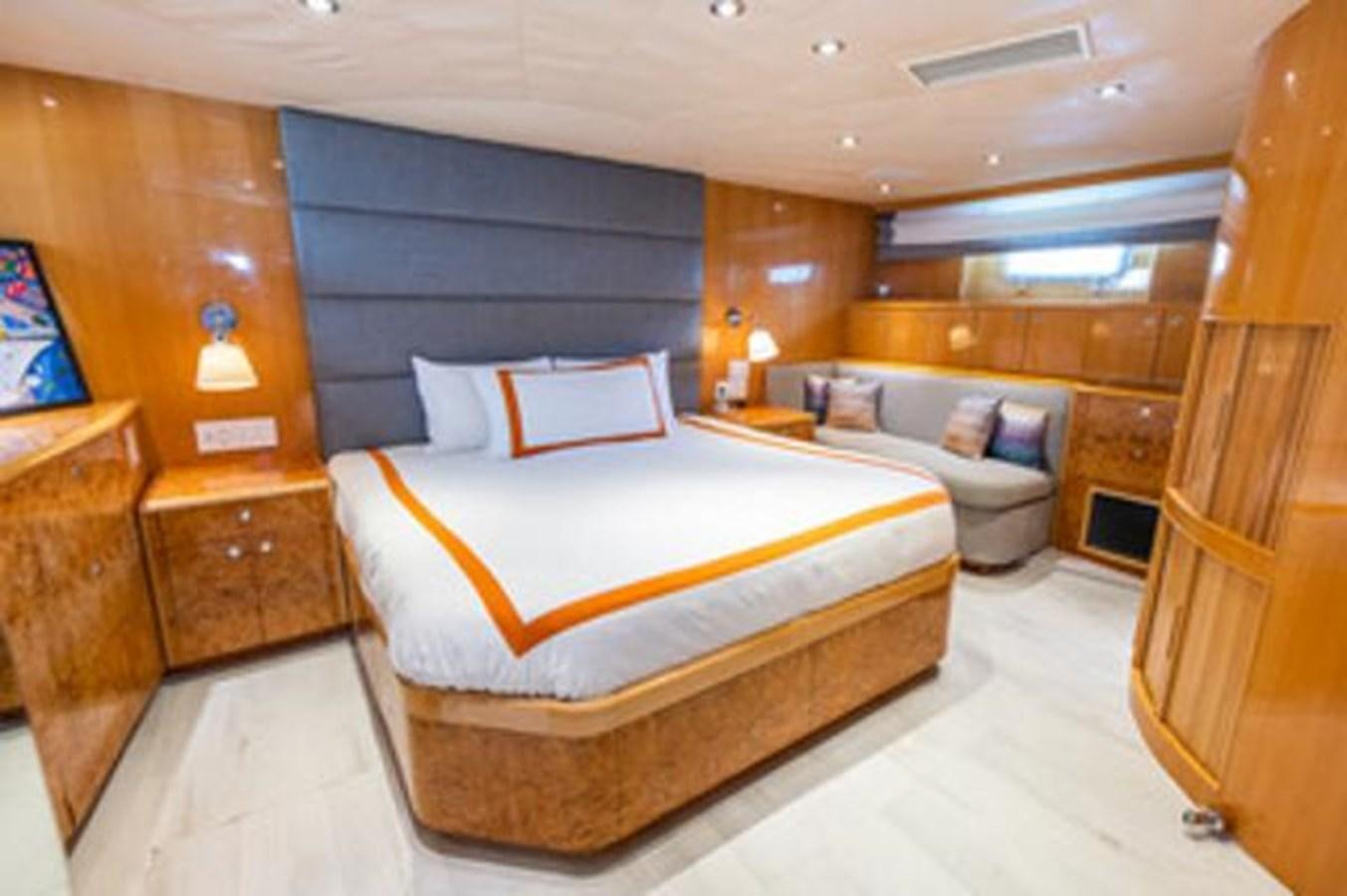 a room with a bed and a couch aboard 2000 116 BAGLIETTO Yacht for Sale