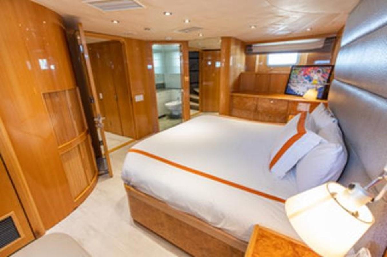 a bed in a room aboard 2000 116 BAGLIETTO Yacht for Sale