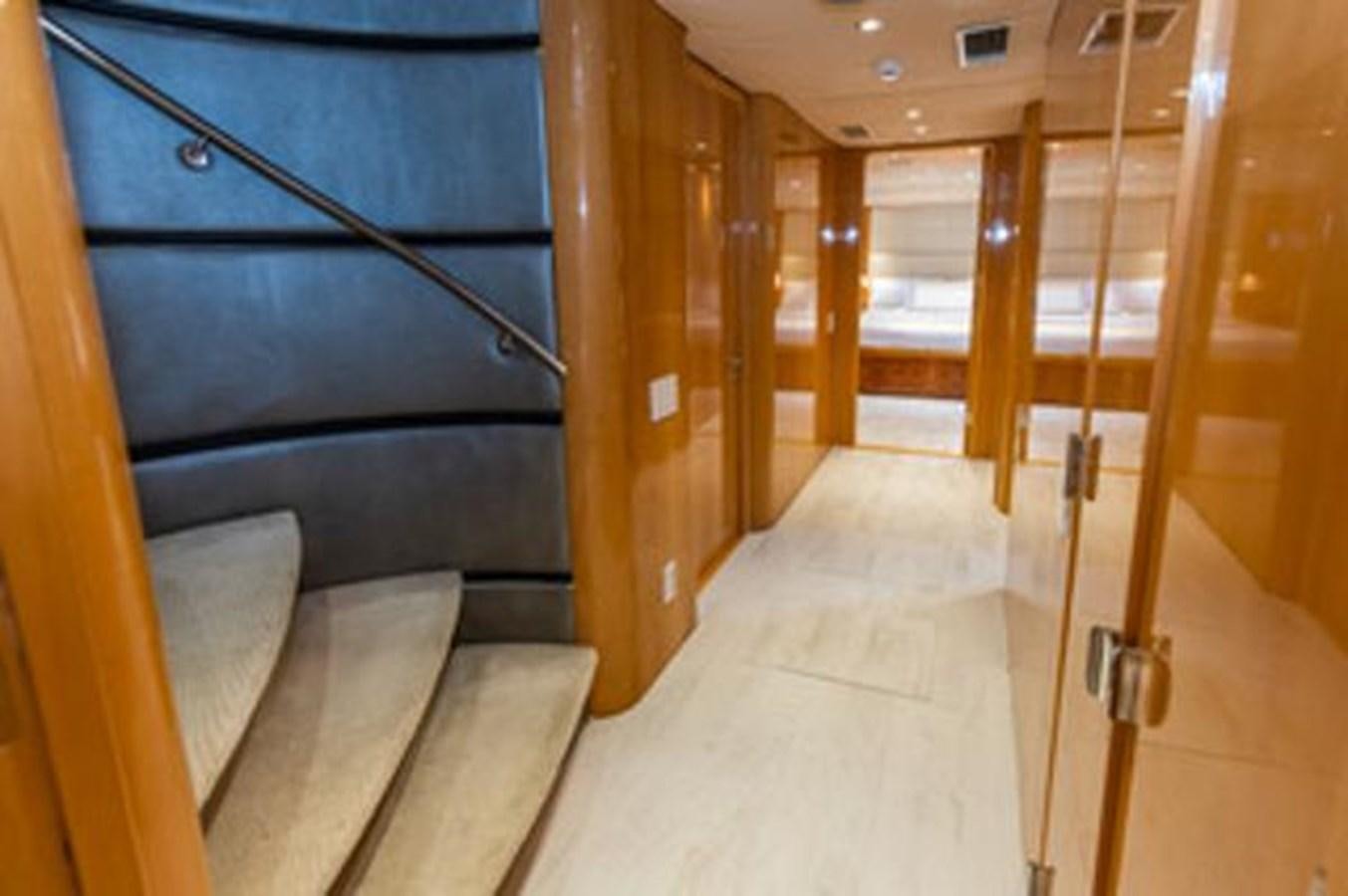 a room with a bed and a chair aboard 2000 116 BAGLIETTO Yacht for Sale
