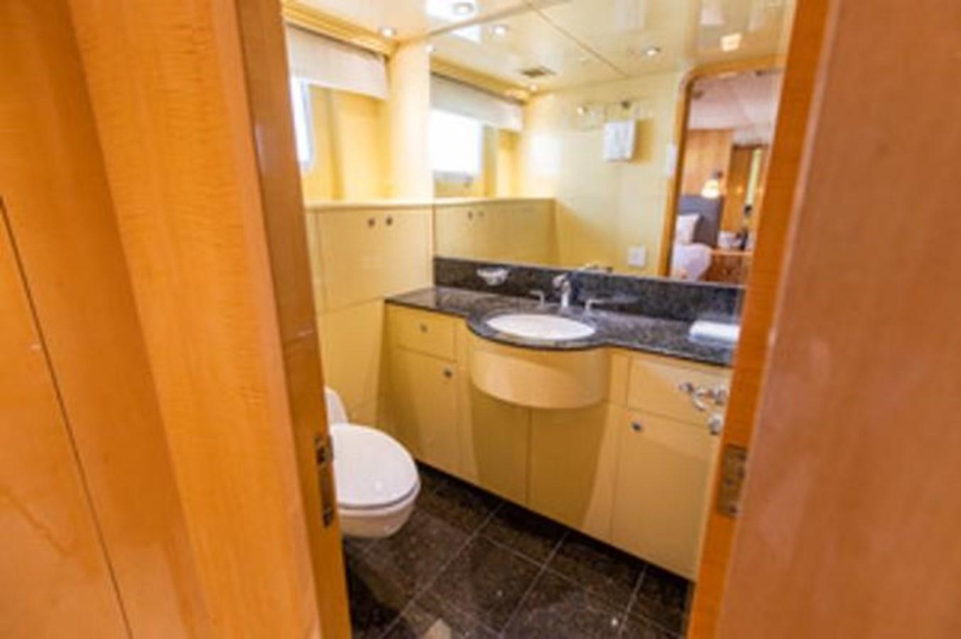 a bathroom with a large mirror aboard 2000 116 BAGLIETTO Yacht for Sale