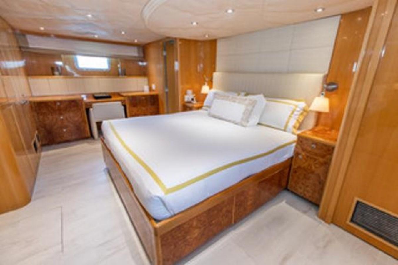 a bed in a room aboard 2000 116 BAGLIETTO Yacht for Sale