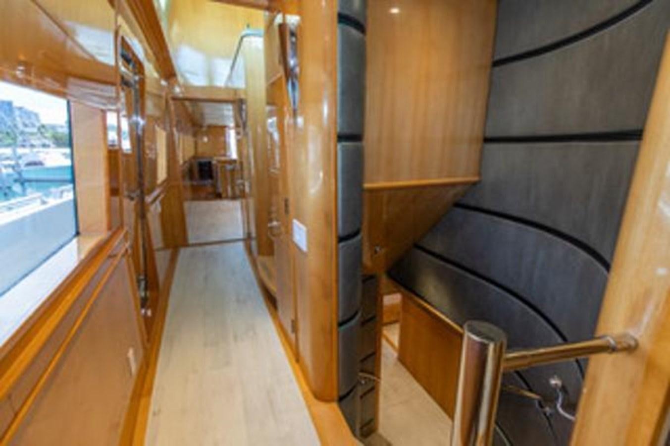 a room with wood walls and wood floors aboard 2000 116 BAGLIETTO Yacht for Sale