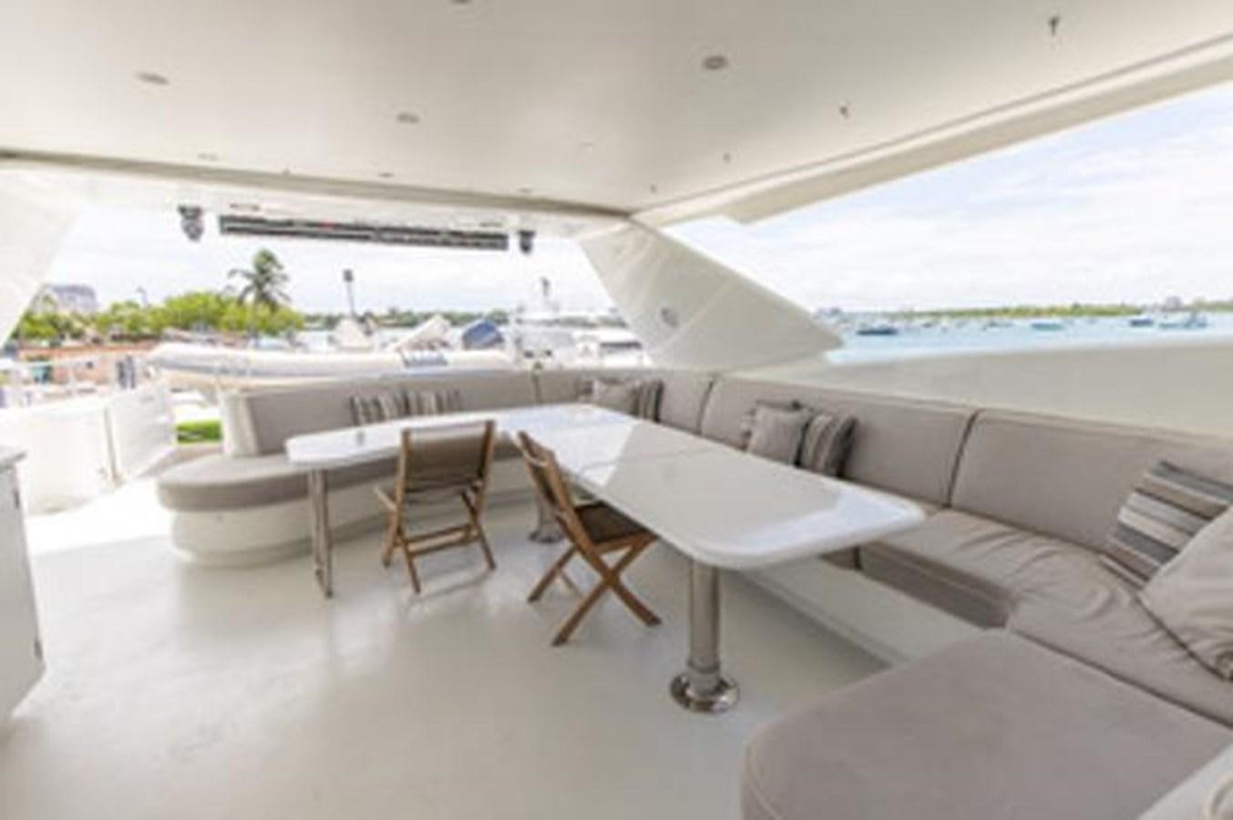 a room with tables and chairs aboard 2000 116 BAGLIETTO Yacht for Sale
