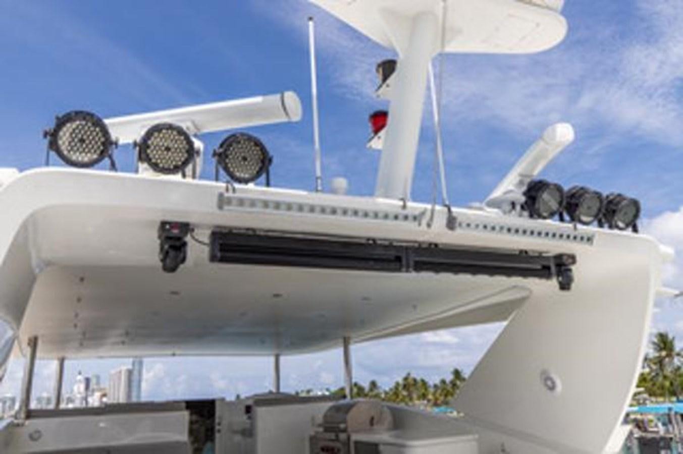 a white boat with a satellite dish on it aboard 2000 116 BAGLIETTO Yacht for Sale
