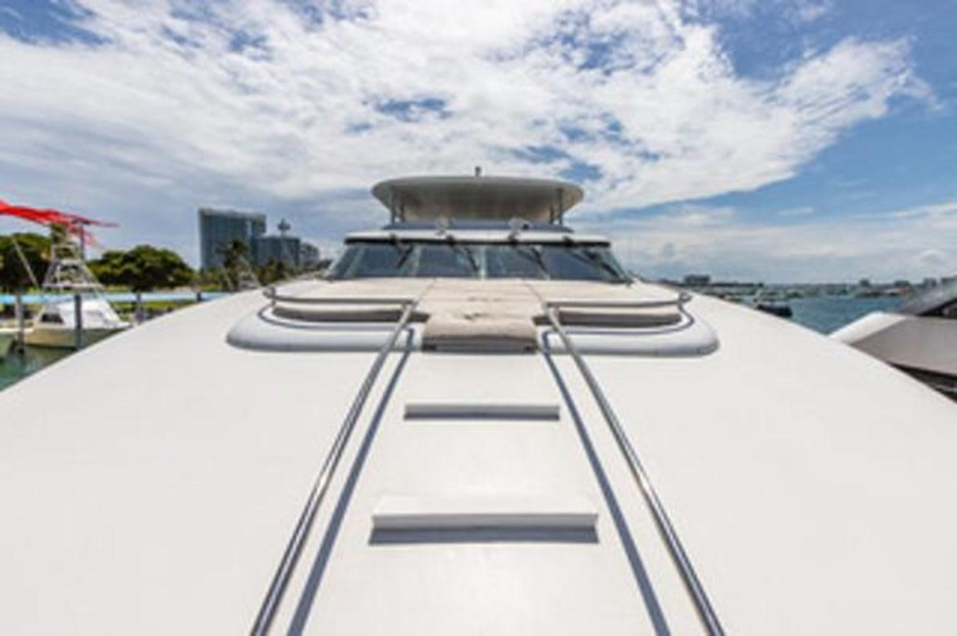 a white boat on a dock aboard 2000 116 BAGLIETTO Yacht for Sale