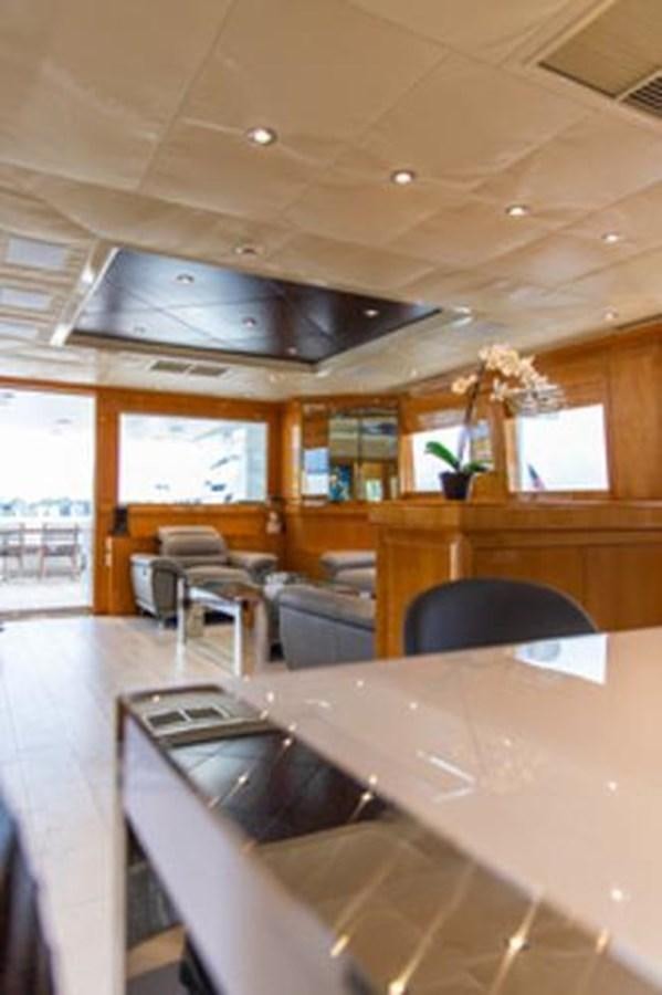 a kitchen with a large island aboard 2000 116 BAGLIETTO Yacht for Sale