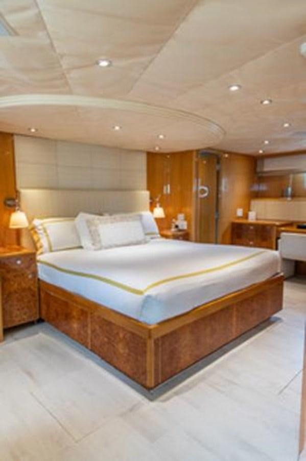 a bed in a room aboard 2000 116 BAGLIETTO Yacht for Sale