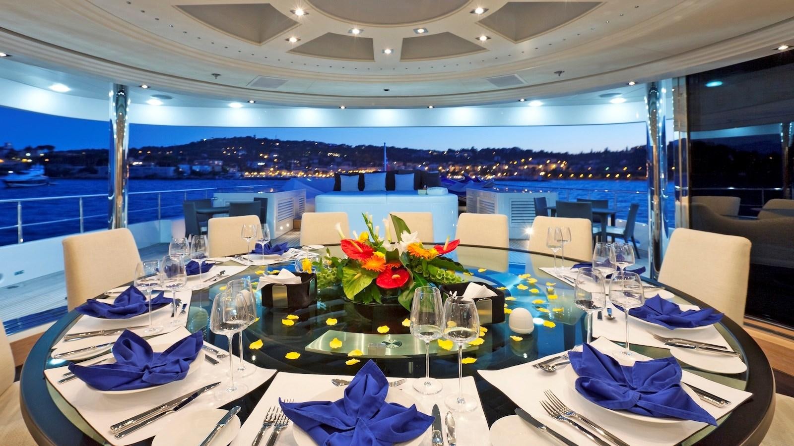 a table set with place settings aboard BELLA 2 Yacht for Sale