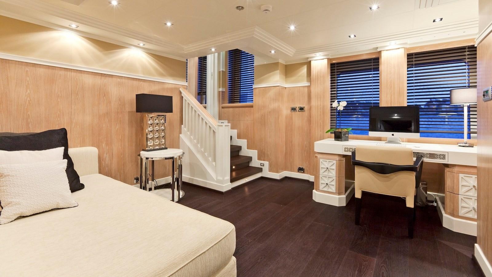 a room with a bed and desk aboard BELLA 2 Yacht for Sale