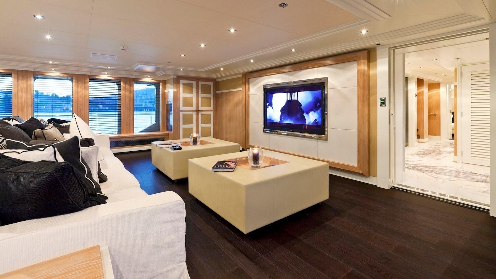 a living room with a large tv aboard BELLA 2 Yacht for Sale