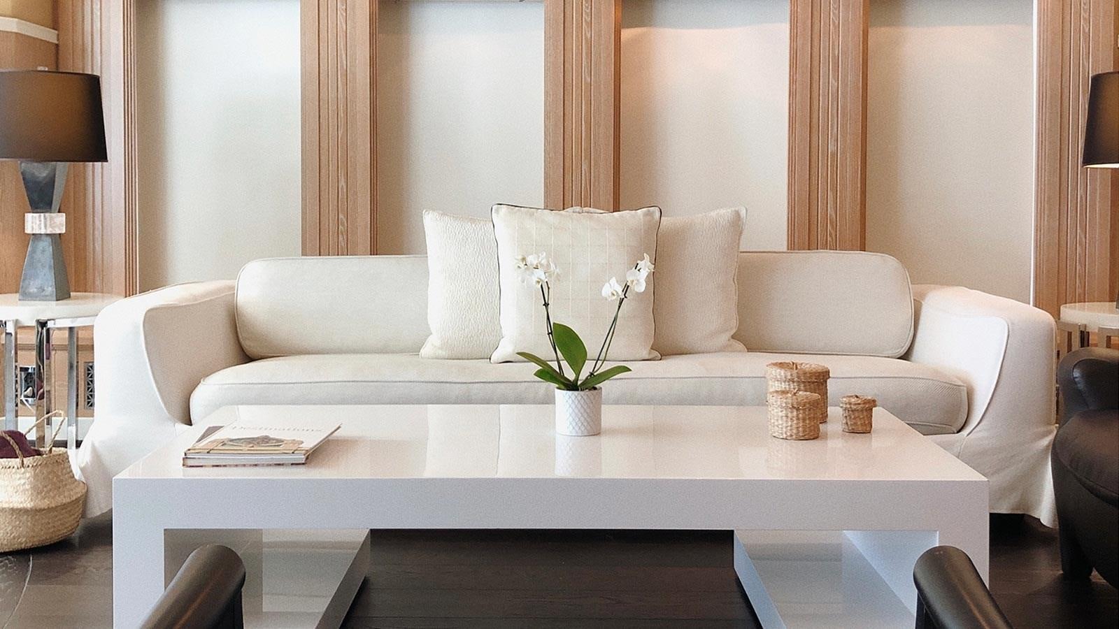 a white couch with pillows aboard BELLA 2 Yacht for Sale