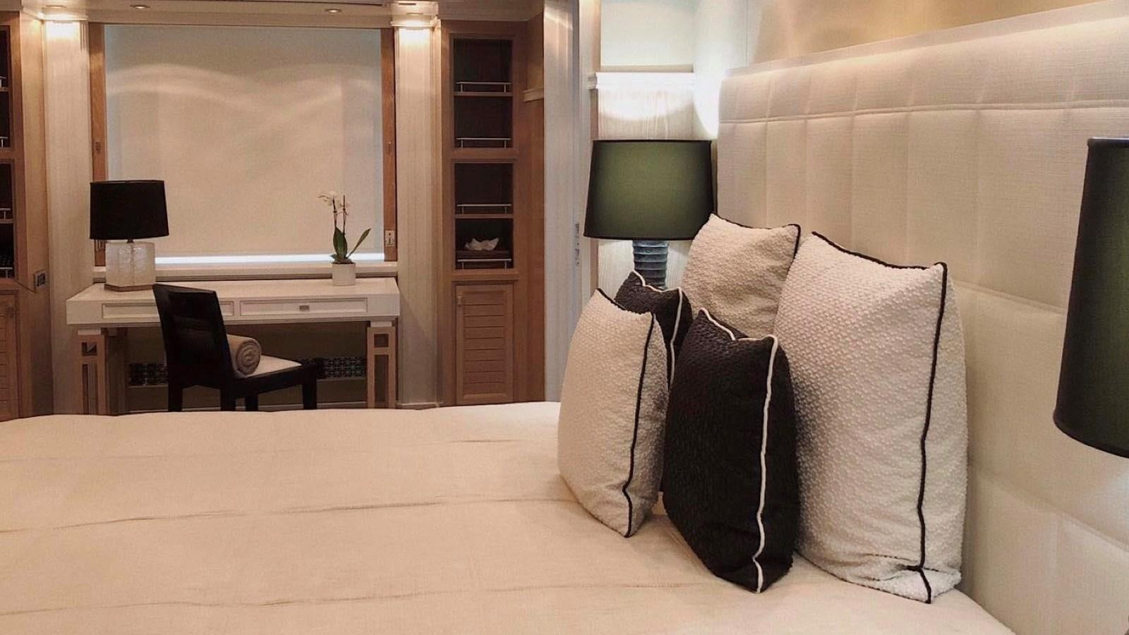 a room with a bed and a desk aboard BELLA 2 Yacht for Sale