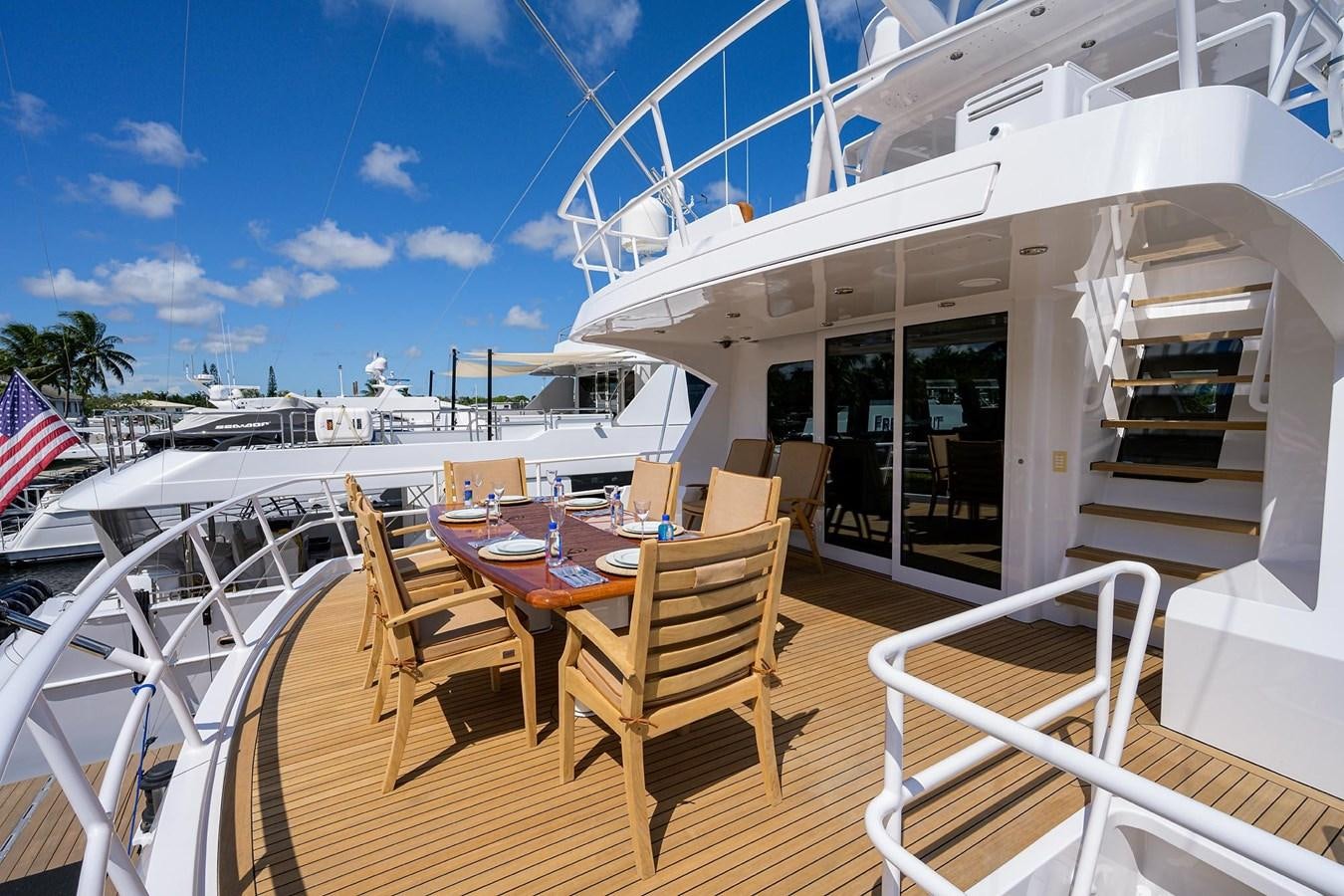 a table and chairs on a deck aboard TEMPO REALE Yacht for Sale