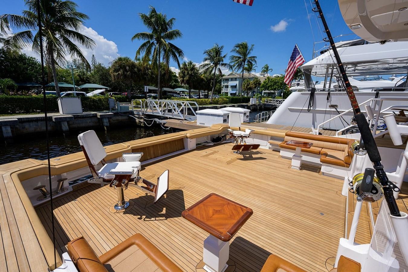 a deck with a deck and chairs aboard TEMPO REALE Yacht for Sale