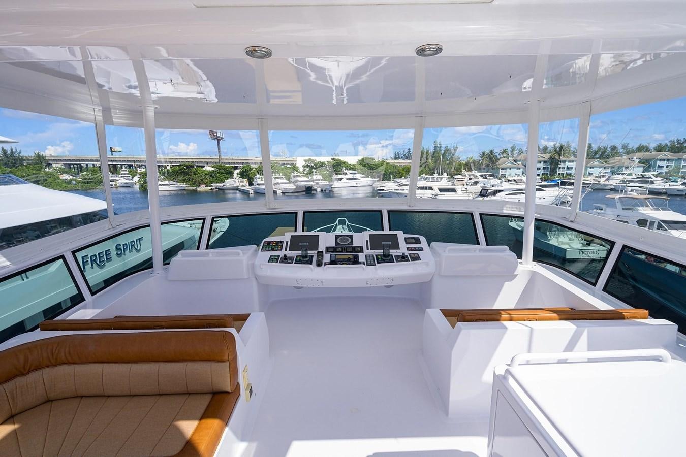 a room with tables and chairs aboard TEMPO REALE Yacht for Sale