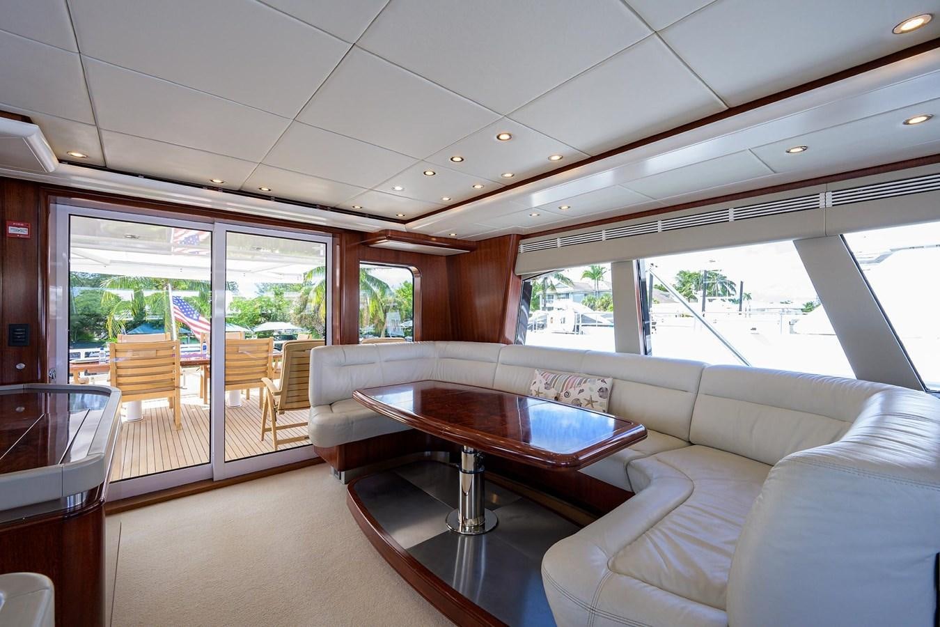 a room with a table and chairs aboard TEMPO REALE Yacht for Sale