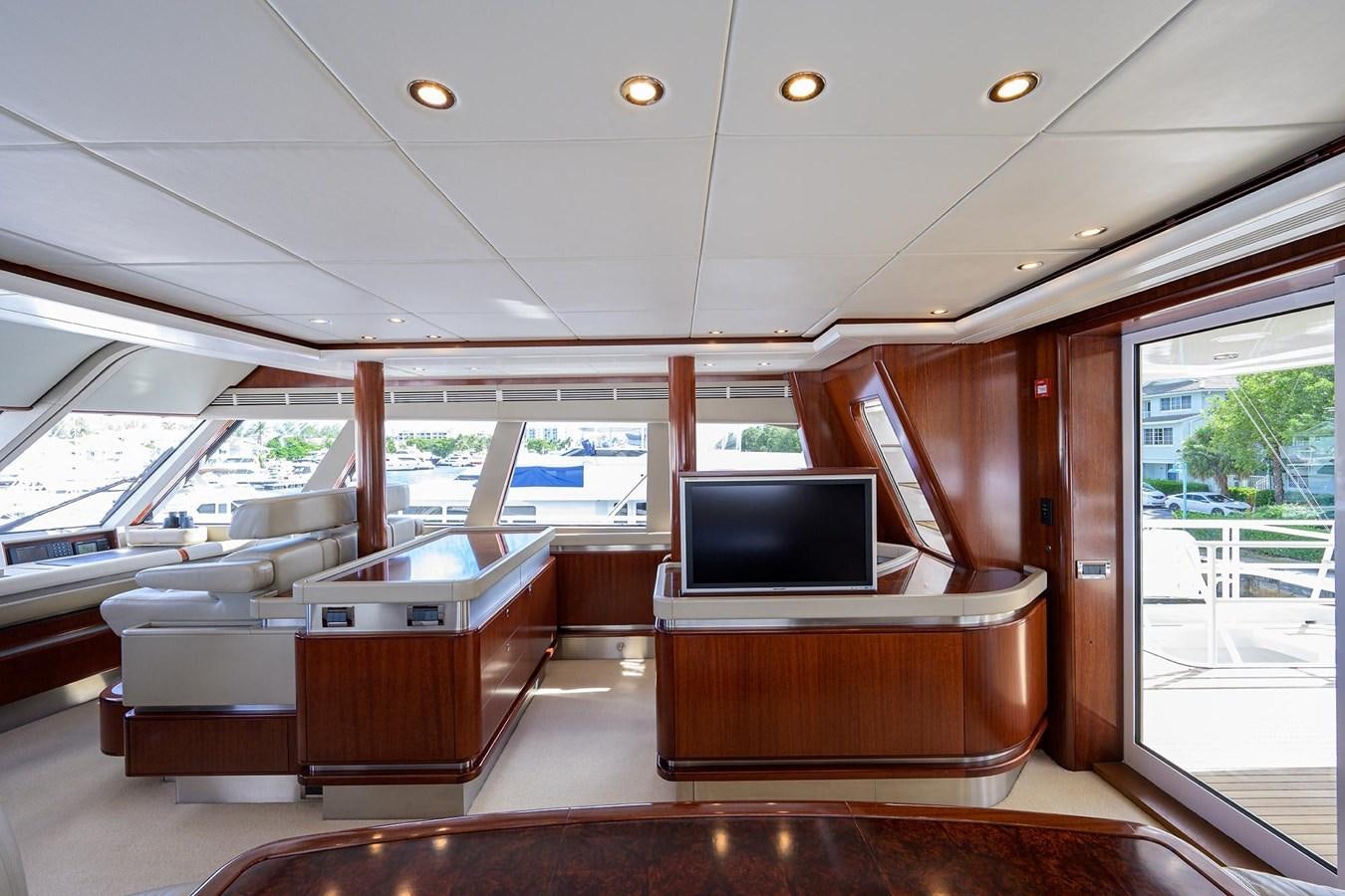 a room with a tv and a table aboard TEMPO REALE Yacht for Sale