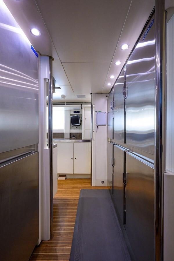 a long hallway with glass doors aboard TEMPO REALE Yacht for Sale