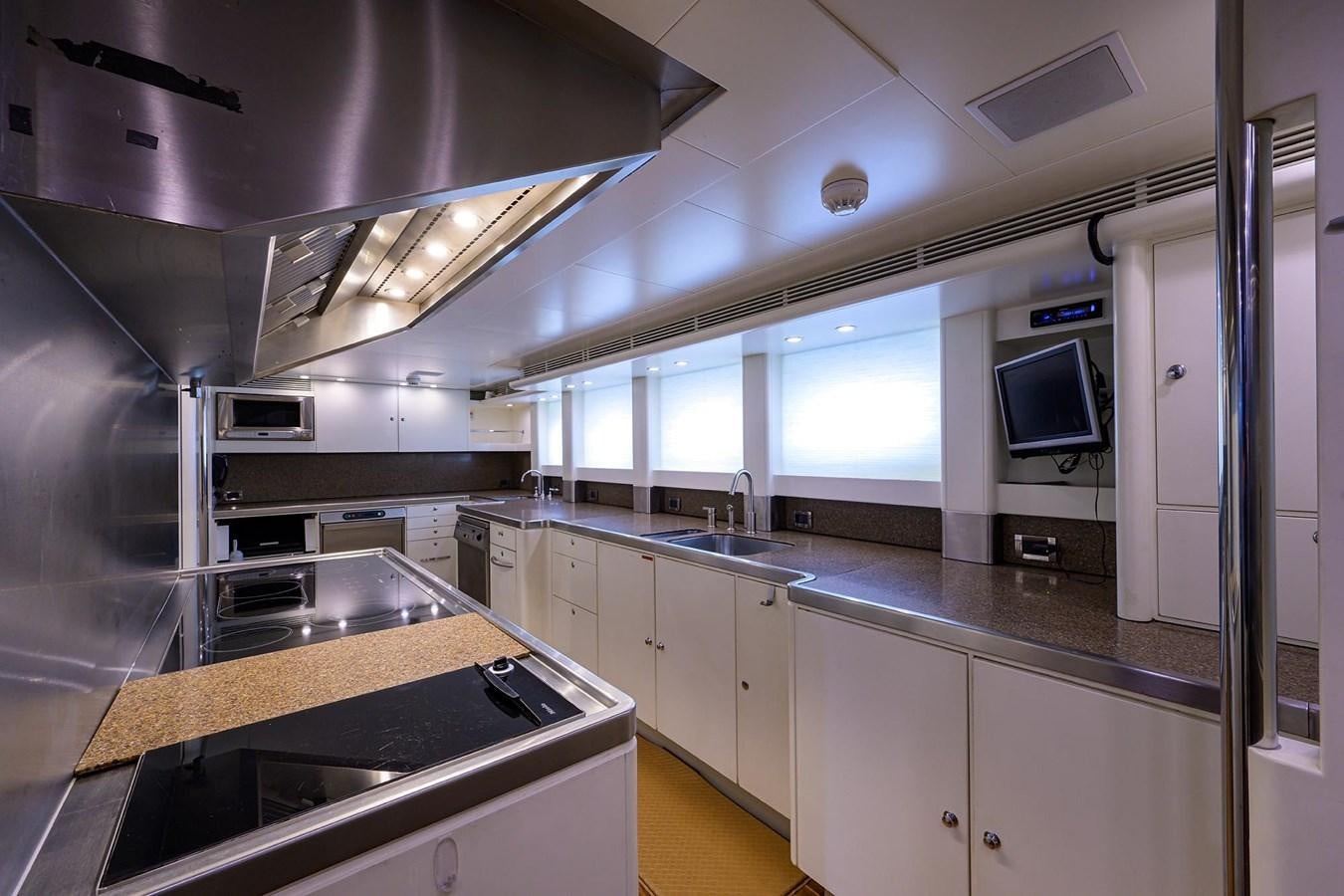 a kitchen with a large island aboard TEMPO REALE Yacht for Sale