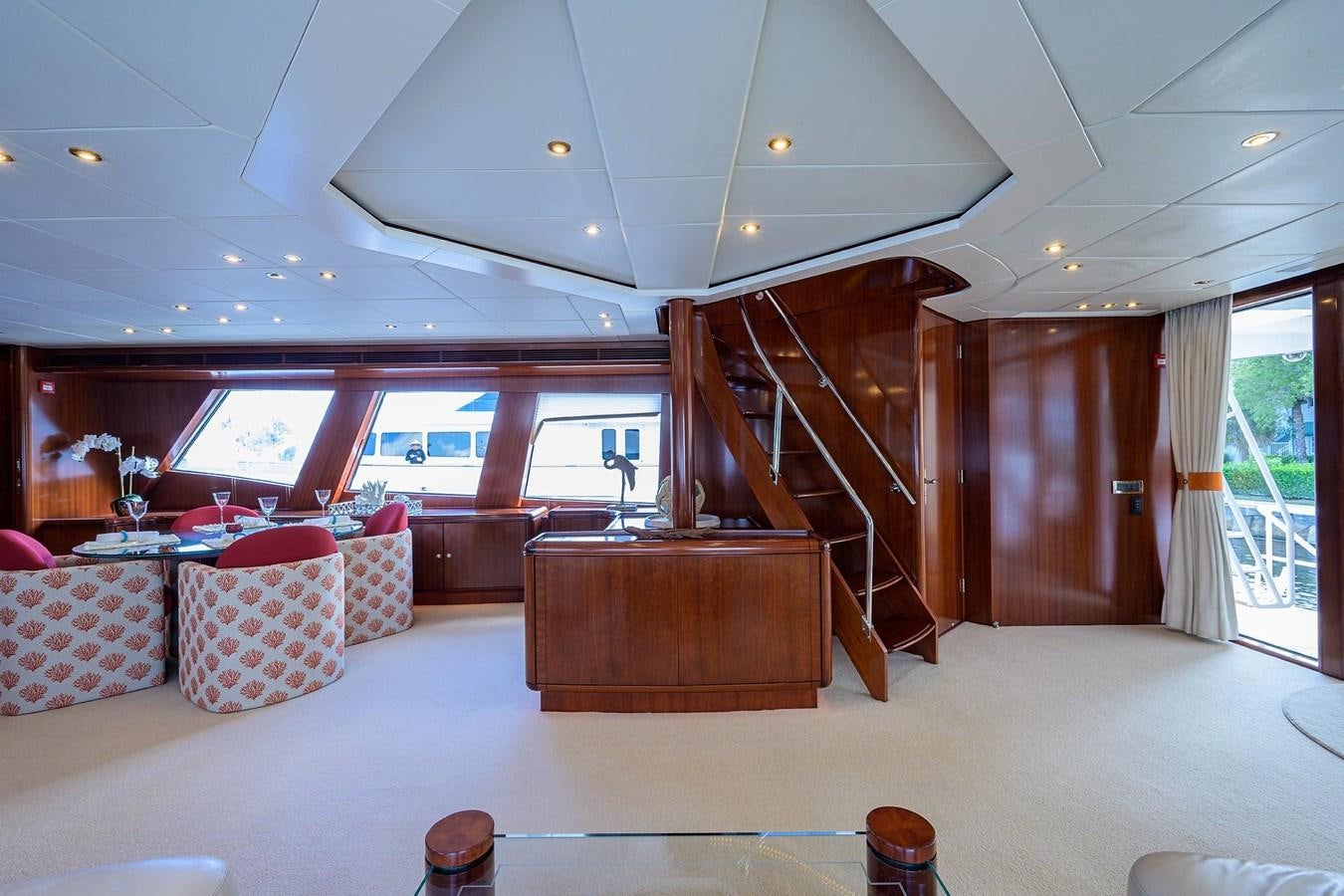 a living room with a staircase aboard TEMPO REALE Yacht for Sale