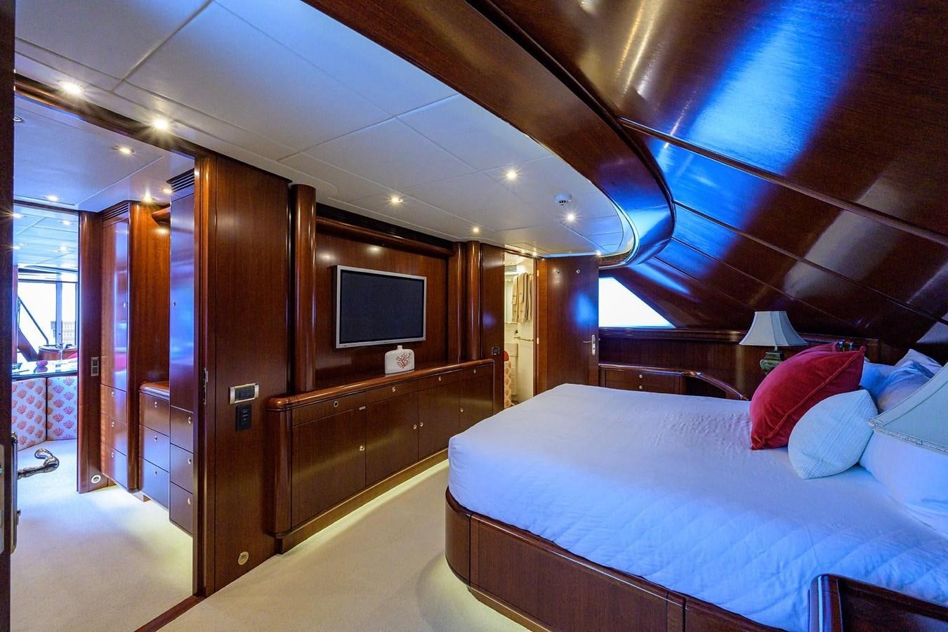 a room with a bed and a television aboard TEMPO REALE Yacht for Sale