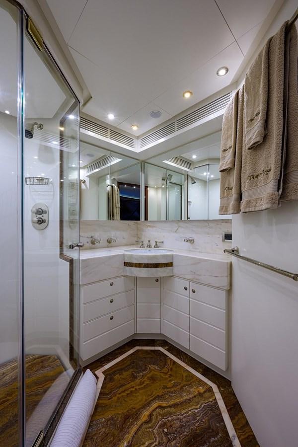 a bathroom with a sink and a mirror aboard TEMPO REALE Yacht for Sale
