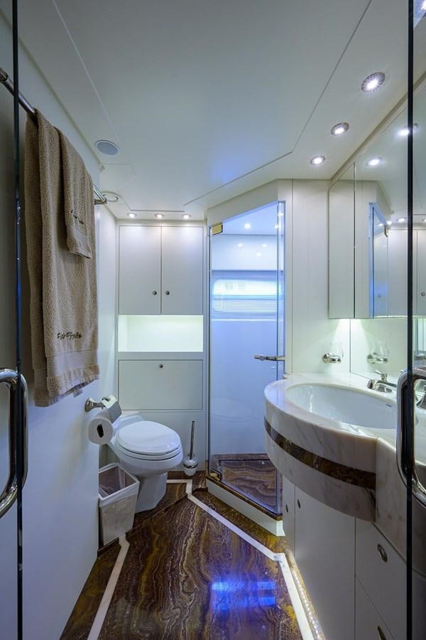 a bathroom with a tub sink and toilet aboard TEMPO REALE Yacht for Sale